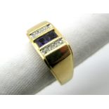 An Amethyst and Diamond Set Ring, three row set between plain tapering shoulders, stamped "14Kt" "