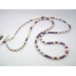A Modern Long Single Strand Fresh Water Pearl Bead Necklace, of graduated design, highlighted with