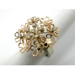 A Modern 18ct White and Rose Gold Designer Style Diamond Set Dress Ring, composed of articulated