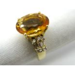 A Modern Citrine and Diamond Set Cocktail Ring, oval four claw set to the centre, high between