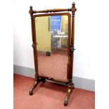 A XIX Century Mahogany Cheval Mirror, rectangular form, having curved corners, on turned and block