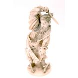 A Late XIX Century Japanese Ivory Figure of a Warrior, his right arm raised holding a sword,