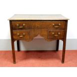A Late XVIII Century Oak Lowboy, the top with moulded edge over one long and two short drawers,