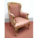 A XIX Century Walnut Wing Chair, with a shaped top rail and wings, upholstered back, arms and
