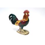 A Beswick Pottery Leghorn Cockerel, on a rocky naturalistic oval base, shape number 1897, paper