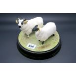 Beswick Pottery "Ewe and I", on a circular tableau base, impressed and printed marks. (3)