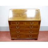 An Edwardian Inlaid Mahogany Bureau, the fall front, with marquetry inlay, fitted interior, two