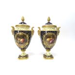A Pair of Early XX Century Coalport Porcelain Vases and Covers, of ovoid form with rams head handles