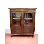 An Early XIX Century Mahogany Bookcase, with glazed doors to two internal shelves, reeded sides,
