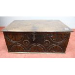 A XVII Century Oak Bible Box, with bail hinges, lock plate to the front and scalloped carved