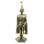 A Mid XX Century Brass Fireside Companion Stand, in the form of a dismounted Life Guard with
