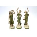 A Pair of Royal Dux Pottery Figures, modelled as maidens, each holding posies, wearing loosely