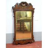 An Early XVIII Century Walnut Mirror, the rectangular plate within a moulded frame with scroll