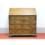 An XVIII Century Style Walnut and Oak Bureau, with feather banding to fall front, fitted interior,