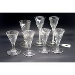 A Pair of Late XIX Century Wine Glasses, with part cut fluted bowls raised on white enamel twist