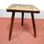 A XIX Century Elm Cutlers Stool, on splayed legs.