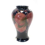 An Early XX Century Moorcroft Pottery Vase, of baluster form, painted in the 'Pomegranate' pattern