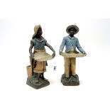 A Pair of Early XX Century Austrian Terracotta Figures, modelled as Moorish basket sellers in