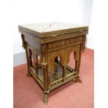 A XX Century Middle Eastern Games Table, heavily inlaid with mother of pearl and boxwood, the