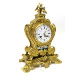 A Late XIX Century French Ormolu Clock, of rococco form with flower surmount, floral painted panels,