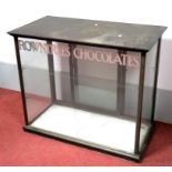 An Early XX Century Rowntrees Chocolates Glazed Display Unit, with sliding double doors and marble