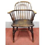 A XIX Century Ash and Elm Windsor Chair, with hooped back and rail supports, turned legs united by