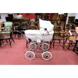An Eichorn Pram, classic vintage styling, chrome chassis, complemented with white hand made wicker