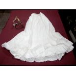 An Edwardian "New Phantom" Wirework Bustle; together with a white cotton lawn bustle petticoat