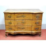 An XVIII Century Walnut Serpentine Shaped Commode, the top with two panels, moulded edge, three