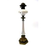 A Late XIX Century Oil Lamp, the white opaque fluted column with foliate scrolling decorated