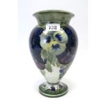 A Moorcroft Pottery Vase, of baluster footed form, painted in the 'Pansy' pattern with pale yellow