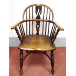 A XIX Century Ash and Elm Windsor Chair, with hooped back and pierced splat, turned legs united by