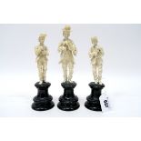 Three Early XX Century Dieppe Ivory Figures, of musicians standing with their instruments, upon
