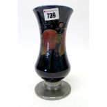 A Moorcroft Pottery Vase, of waisted baluster form, painted with the 'Pomegranate' pattern against a