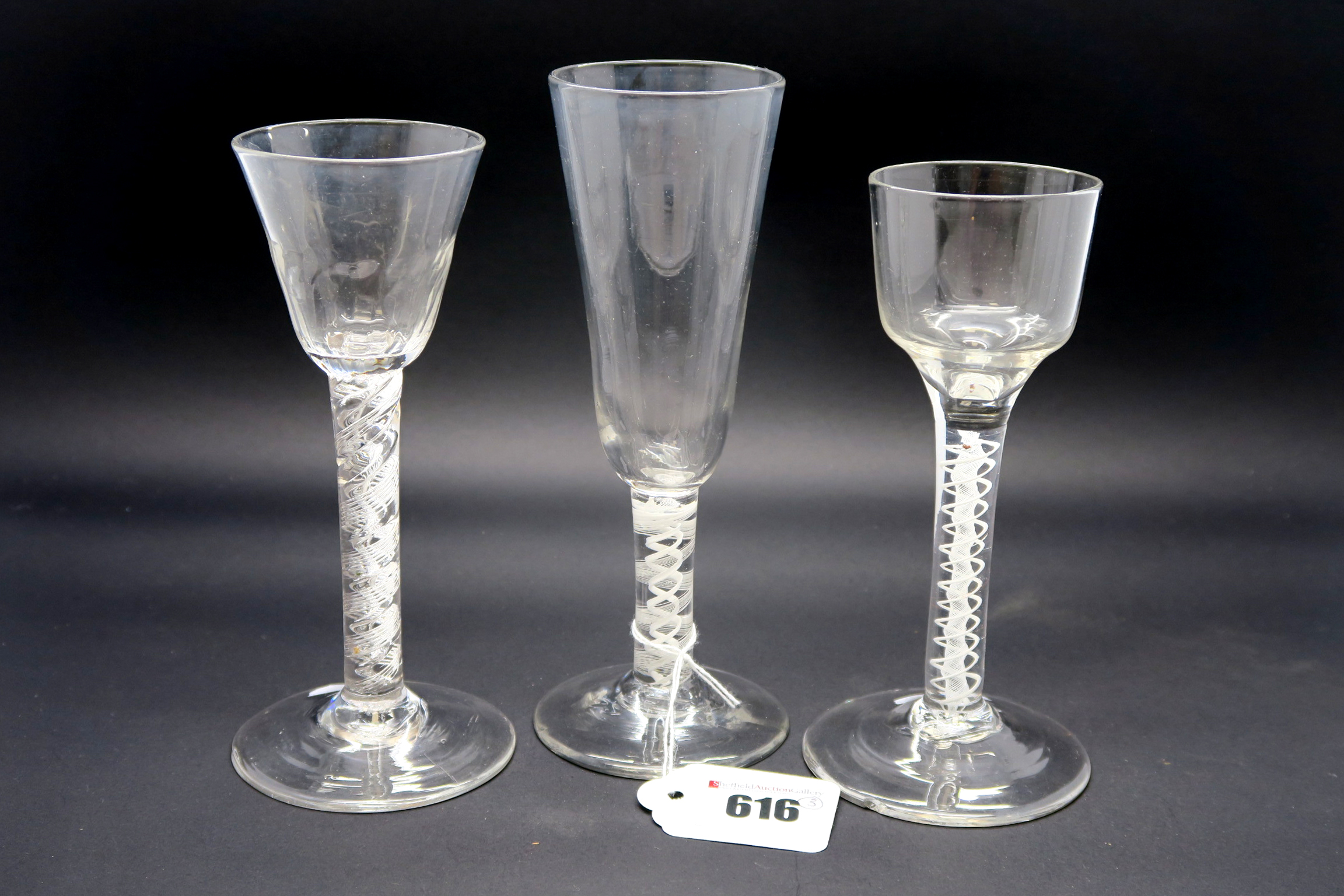 A Mid XIX Century Tall Ale Glass, the tapered bowl raised on a short white enamel twist stem and