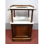 A XIX Century Mahogany Toilet Stand, with three-quarter brass gallery and towel rails, marble top,
