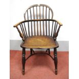 A XIX Century Ash and Elm Windsor Chair, with hooped back and rail supports, turned legs united by