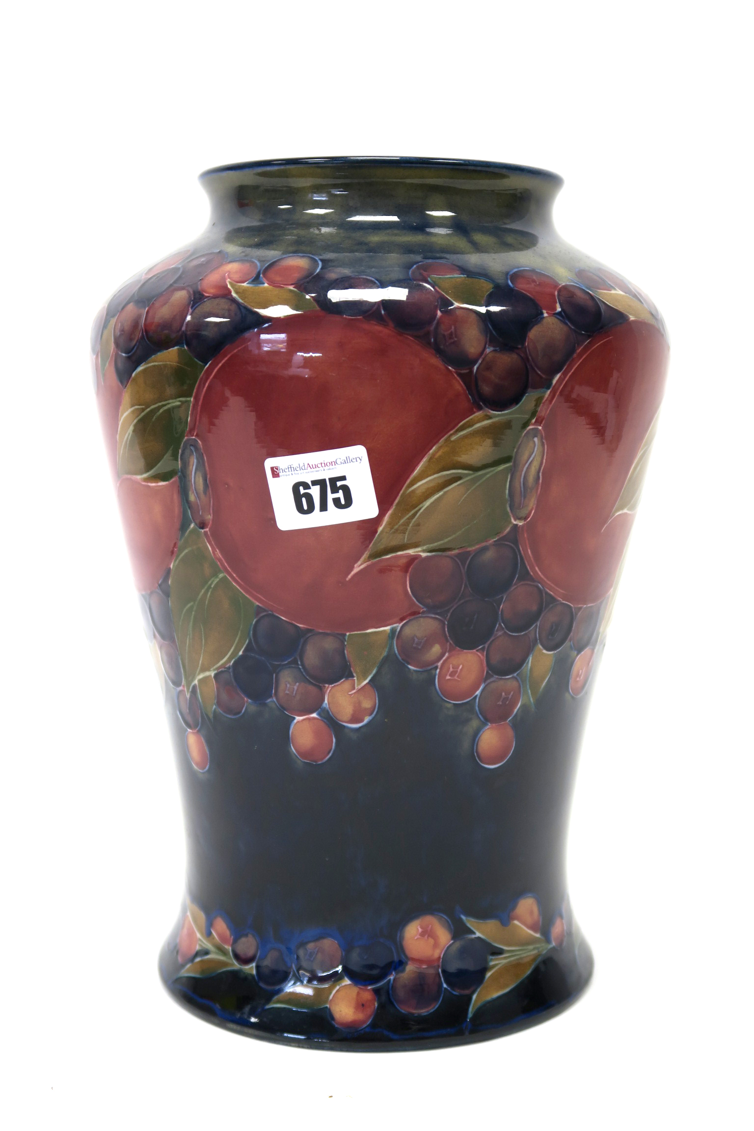 A Moorcroft Pottery Vase, of tapered form with short outcurved rim, painted in the 'Pomegranate'