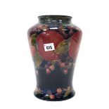 A Moorcroft Pottery Vase, of tapered form with short outcurved rim, painted in the 'Pomegranate'