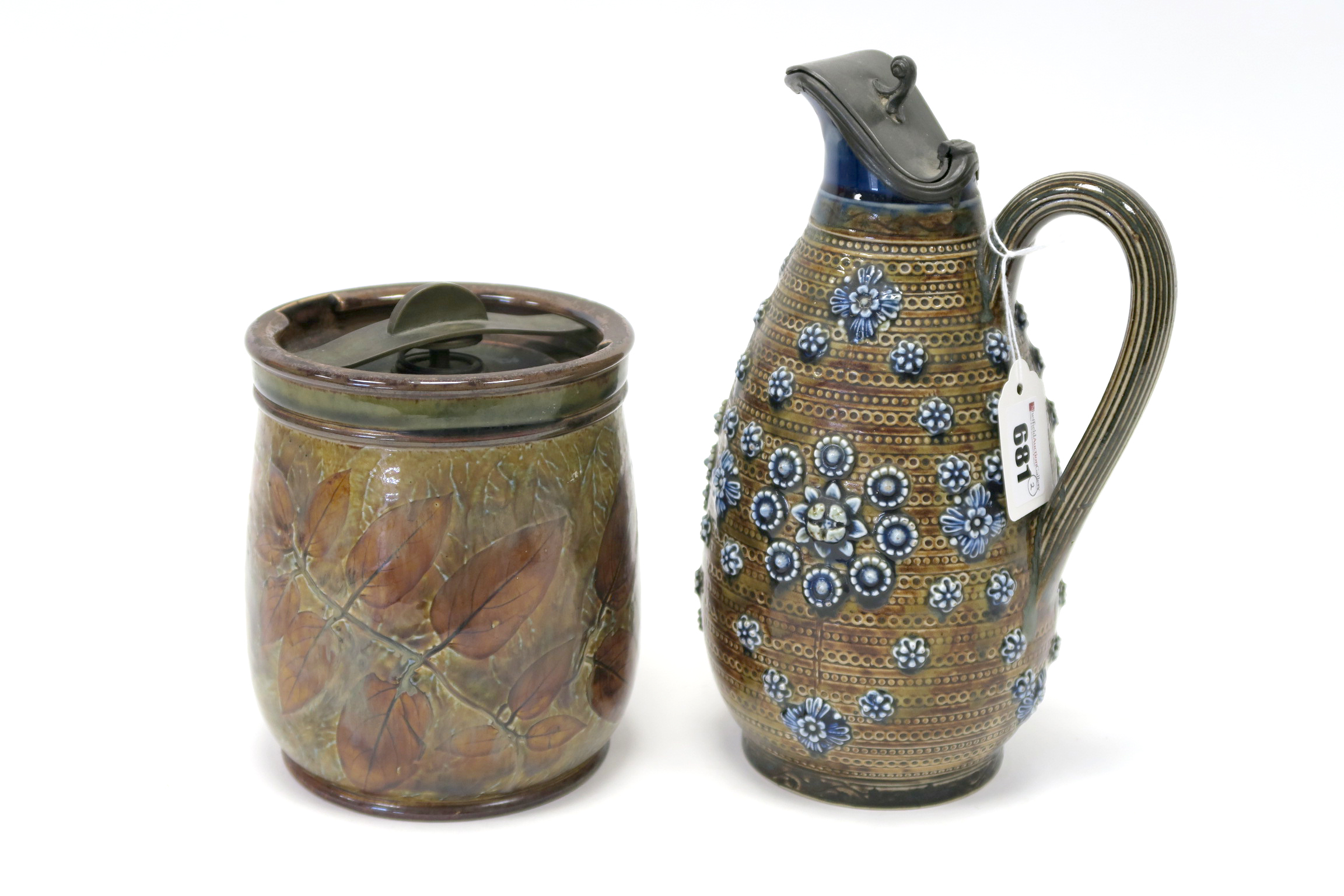 A Royal Doulton Stoneware Tobacco Jar and Cover, with brass mounts, impressed and painted with brown