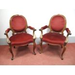 A Pair of XIX Century Rosewood Salon Armchairs, in the Queen Anne style, each with floral cresting