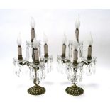 A Pair of Mid XX Century Continental Brass Three Branch Candelabra's, with faceted lustre drops,