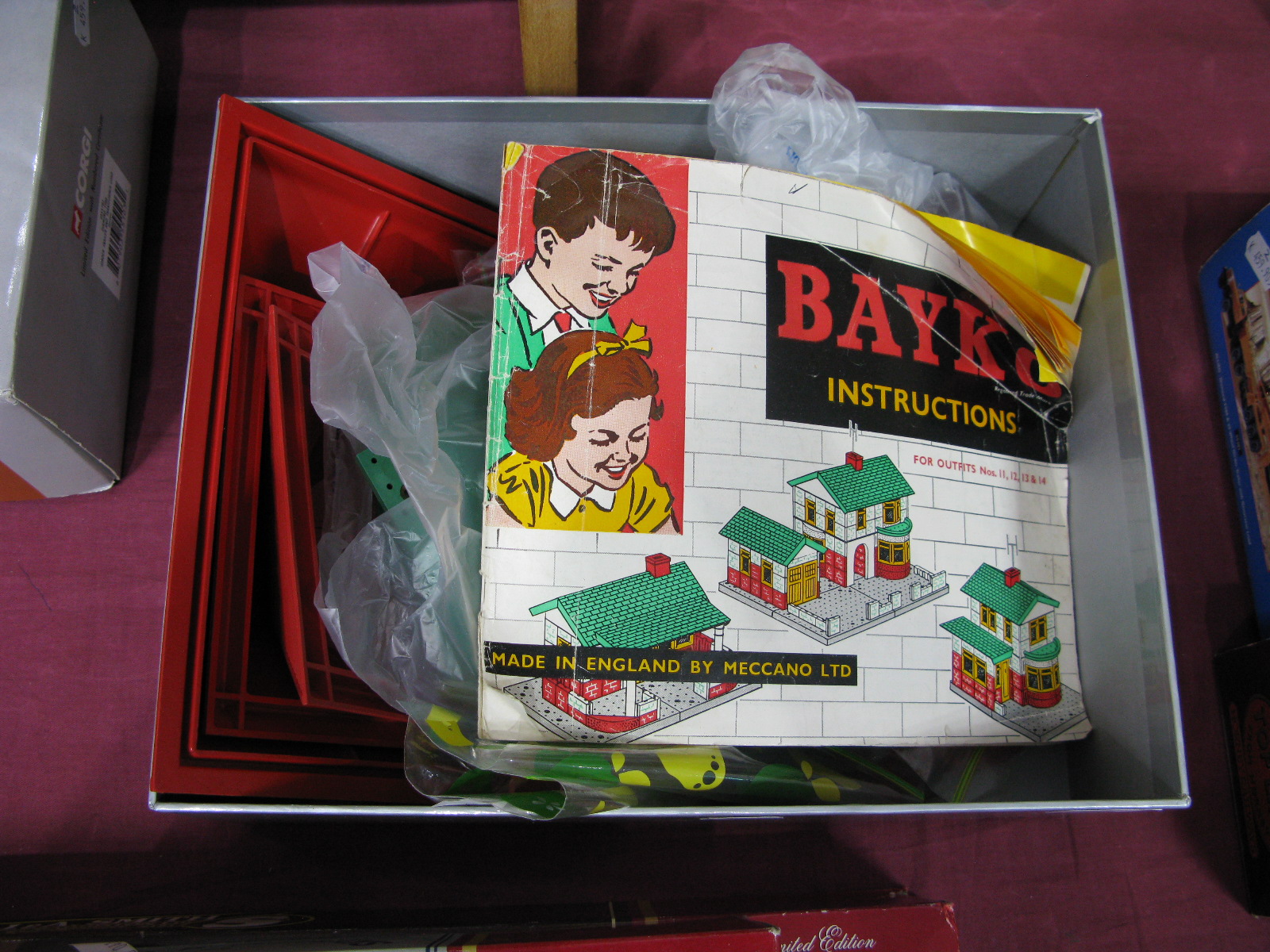 A Quantity of Bayko Loose Construction Parts, including roofs, bricks, flats, pillars, instruction