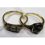 A Three Stone Ring, rubover set; together with a cluster ring (lacking stone). (2)