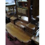 A XIX Century Mahogany Duchess Dressing Table, with swing mirror, and six various drawers.