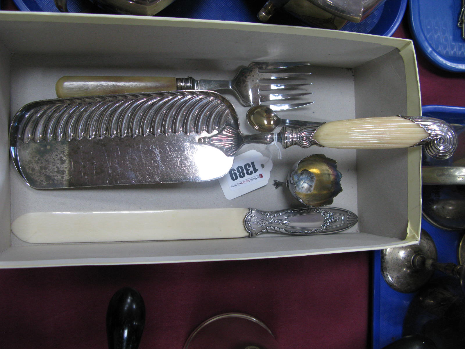 A Decorative Crumb Scoop, the reeded handle with hallmarked silver mounts, EH, Sheffield 1891;