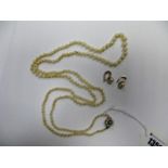 A long Graduated Single Strand Pearl Bead Necklace, to flowerhead cluster clasps; together with a