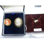 An Oval Shell Carved Cameo Brooch; together with a cameo style brooch and a pig pendant on chain. (