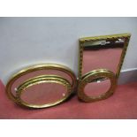 A Rectangular Shaped Gilt Mirror, two oval shaped gilt mirrors and a circular pressed brass