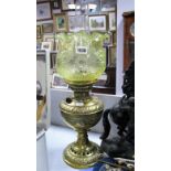 A Late Victorian Brass Paraffin Lamp, moulded decoration of foliate gadroon borders and pierced